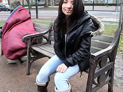 Lewd amateur brunette girlie in jeans pisses while sitting on the bench