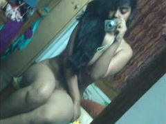 Kinky long haired Indian gal shows off her big boobs and sexy bum for you