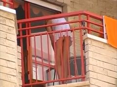 Hot petite blonde neighbor on the balcony filmed upskirt