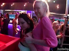 Sexy lesbians dancing in club