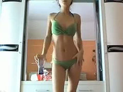 Dazzling amateur chick posing for camera in green bikini
